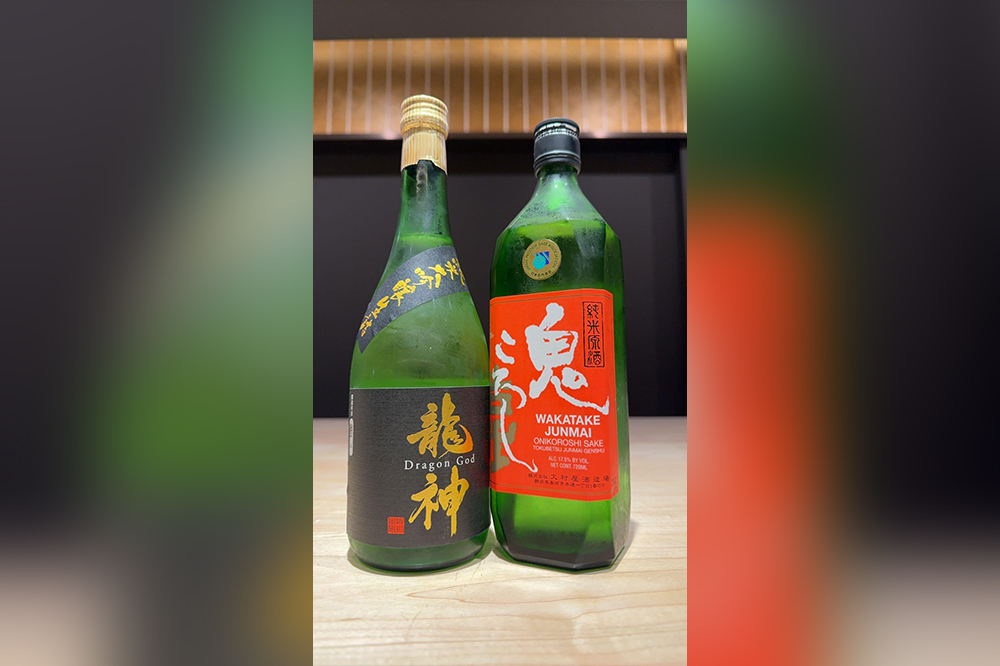 Japanese sake bottles including Dragon God and Wakatake Onikoroshi